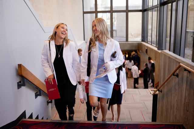 Two new doctors in white coats